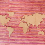 A map of world shown flat against a reddish background to indicate risk